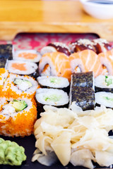 sushi on a black plate