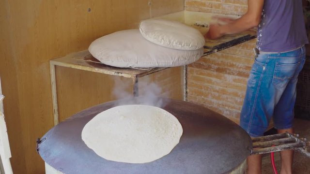 Creating markouk bread on a saj