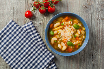 Minestrone soup with pasta and cheese.