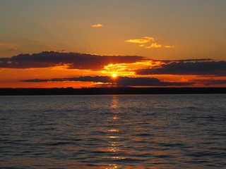 Sunset. On the big river. Coast. Beautiful clouds. Summer. Russia, Ural, Perm region