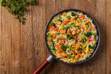 Nasi goreng. Fried rice with egg and vegetables.