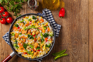 Nasi goreng. Fried rice with egg and vegetables.