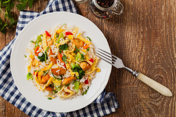 Nasi goreng. Fried rice with egg and vegetables.