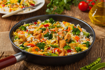Nasi goreng. Fried rice with egg and vegetables.