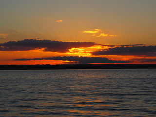Sunset. On the big river. Coast. Beautiful clouds. Summer. Russia, Ural, Perm region