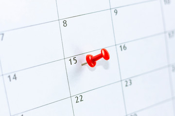 15 date pinning on calendar with Red color pin thumbtack. Save the Date. concept tax day.