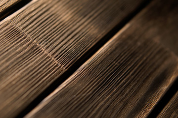 Background with a diagonal pattern of natural wood and a small depth of field
