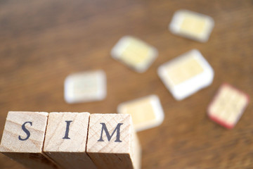 Wooden Text Block of SIM and SIM cards