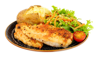 Chicken and baked potato meal with fresh salad isolated on a white background