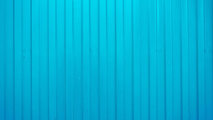 Blue color corrugated metal sheet with leaf shadow background
