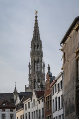 Brussels town hall tower seen from a backstreet
