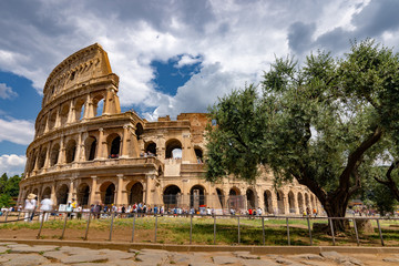 Naklejka na ściany i meble Tourists Visiting The Colosseum in Rome Italy