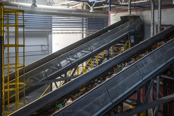 moving conveyor transporter on Modern waste recycling processing plant. Separate and sorting...
