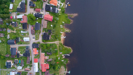 View from above. The houses on the riverbank. Beautiful village