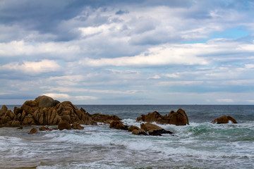 Fototapeta na wymiar Seascape with red rocks