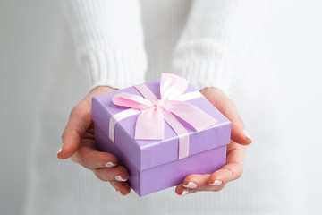 Gift box on woman hands