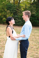 Obraz premium International young attractive romantic couple in beautiful park