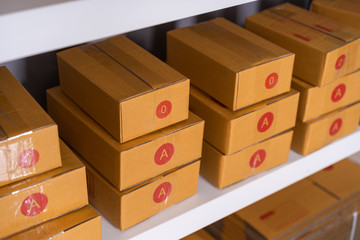 Parcels on shelf ready for shipment to client in the home office