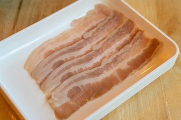 raw sliced red pork for grilled barbecue in tray