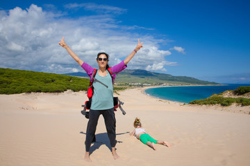 woman and girl on top of the dune of Bolonia Beach in Cadiz © Q