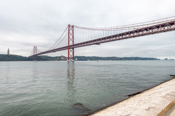 25th April Bridge in Lisbon on a cloudy day