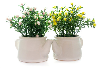 Artificial plastic flowers isolated on white background.