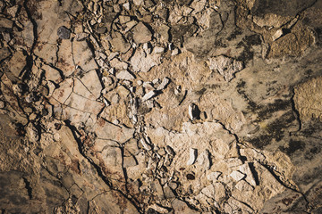 Stone background with old crumbs and splinters