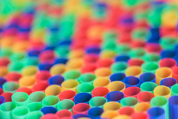 Large group of colorful plastic drinking straws