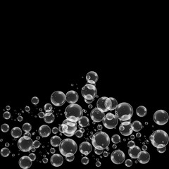 Realistic soap bubbles with rainbow reflection set isolated on the black background.