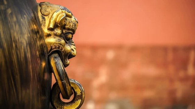Chinese elements: Gold animal face Statue in the Forbidden City, Beijing, China. Symbol of Chinese traditional culture.The element of design.