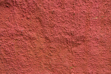 Rough red decorative facade plasters texture.