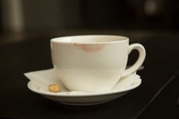 Coffee cup and saucer on a wooden table.
