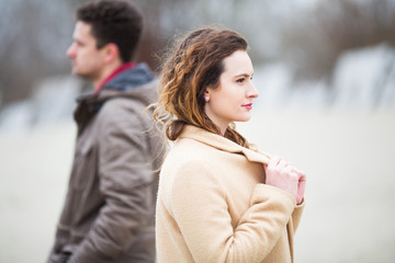 Young couple at windy beach