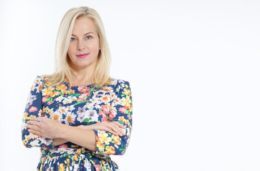 Middle aged woman in blue dress portrait. Success. Isolated over white background.