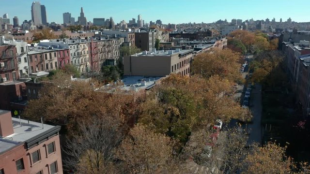 Autumn flying forwards shot of block in Carroll Gardens Brooklyn
