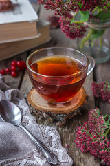 Life style of comfort in the autumn. A cup of tea in the living room on a wooden table, autumn...