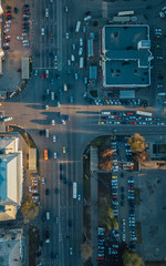 Top view of road intersection and parking lot taken by drone