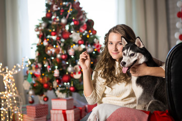 Obraz premium Teen girl with dog , for Christmas