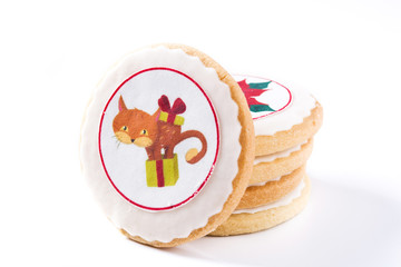 Homemade butter cookies with a printed Christmas cat design isolated on white background. 