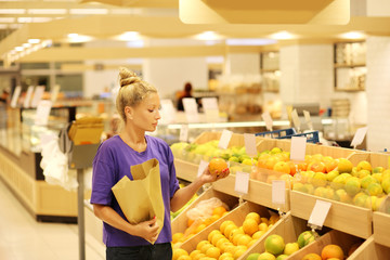 Woman buying fruits at the market