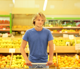 Teenager buying fruits at the market