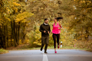 Young people jogging and exercising in nature