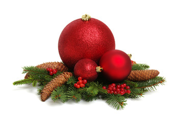 Christmas decoration: red balls with cones and fir tree branches