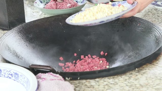 Stir fry Chinese food by iron pan