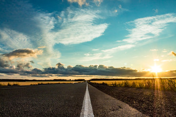 Fototapeta na wymiar The road going into the sunset