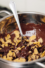 Chocolate covered cornflake cluster cookies, an easy and fun holiday or Christmas cooking project with kids, no-bake recipe for tiny cakes or semi-sweet cocoa snacks