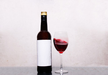 A bottle and glass of Wine