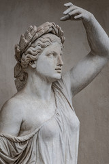 Naklejka premium Statue of sensual Roman renaissance era woman in circlet of bay leaves, Potsdam, Germany, details, closeup