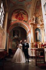 Wedding photo in the Church.Beautiful young couple