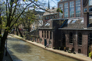 Utrecht. Canal in the center of the city. Bicycles standing on the bridge 
